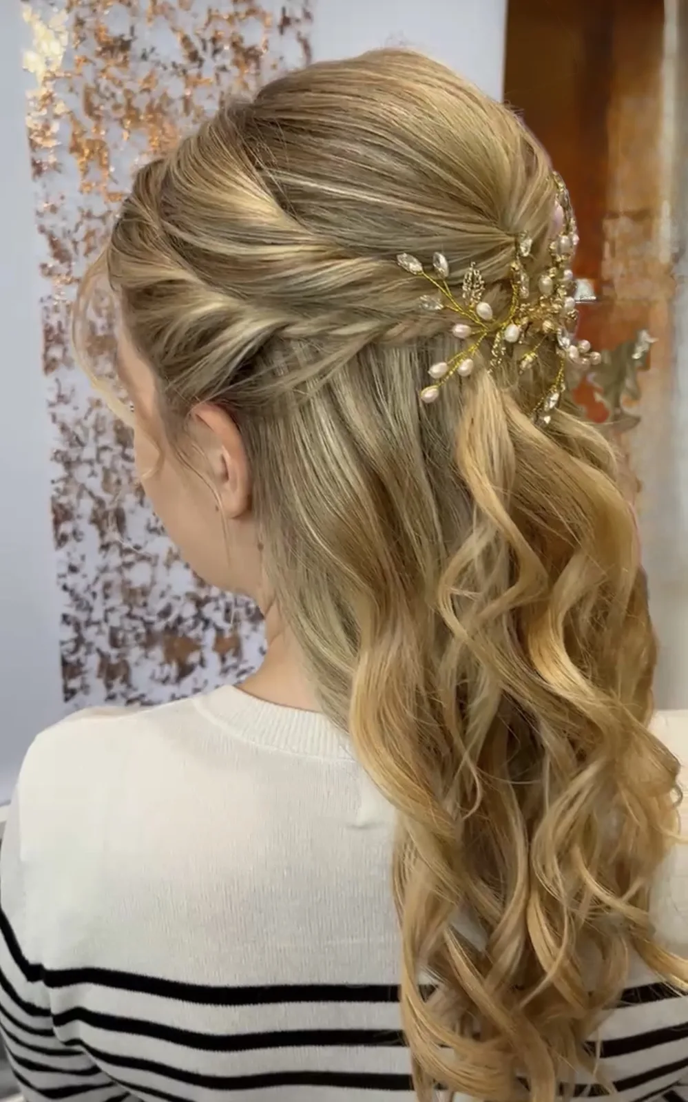 Half-updo styled with weft hair extensions for an occasion