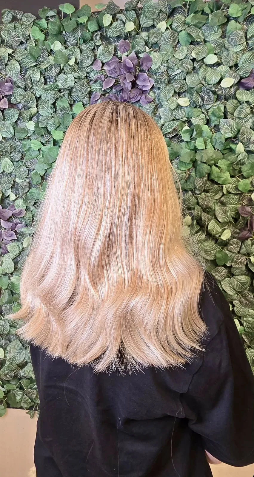 Long blonde hair extensions photographed outdoors with natural movement