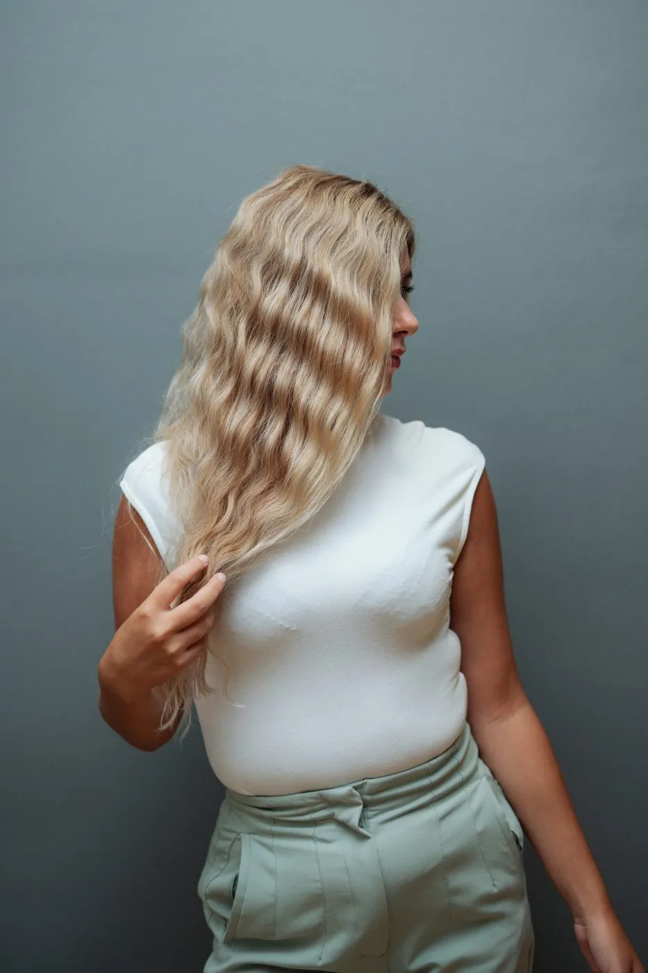 Seamless blonde extensions, styled waves — HEADS Makati